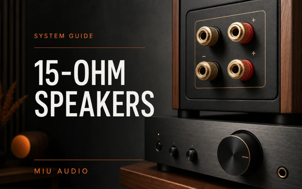 A close view of loudspeaker binding posts and amplifier controls beside the words 15-Ohm Speakers